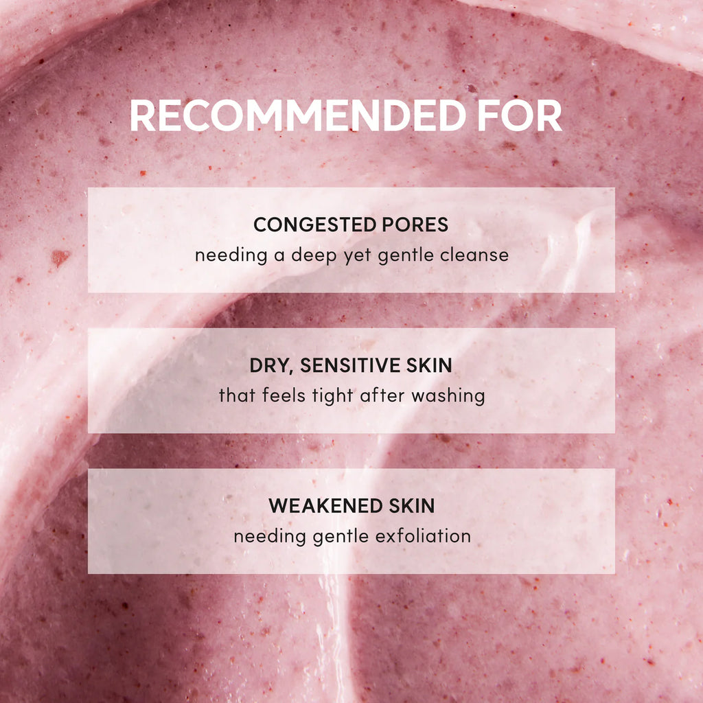 Close-up of a pink scrub with text indicating its use for congested pores, dry sensitive skin, and weakened skin.