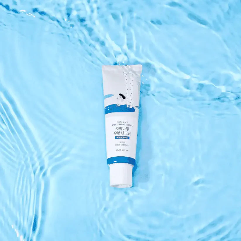 Tube of cream on a blue water background