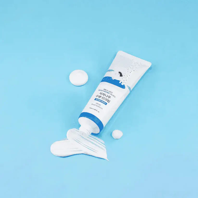 Tube of white cream with blue label on a light blue background