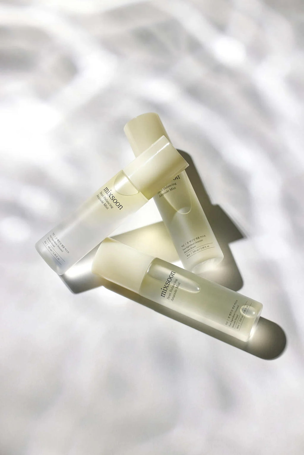 Cutis Clinique, Set of skincare MIXSOON bottles on a soft white background