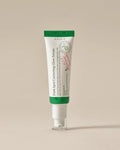 Tube of Axis-Y Dark Spot Correcting Glow Serum on a beige background