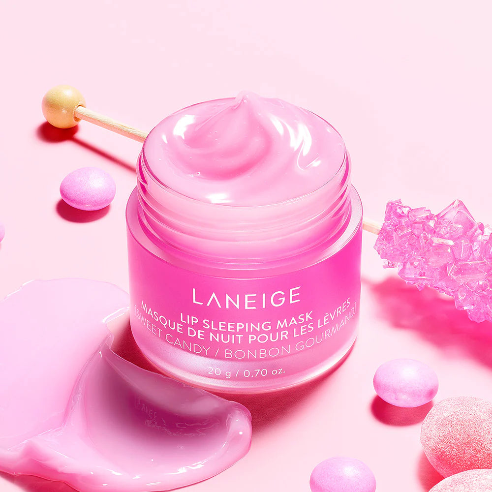Pink Laneige lip sleeping mask jar on a pink background with decorative elements.