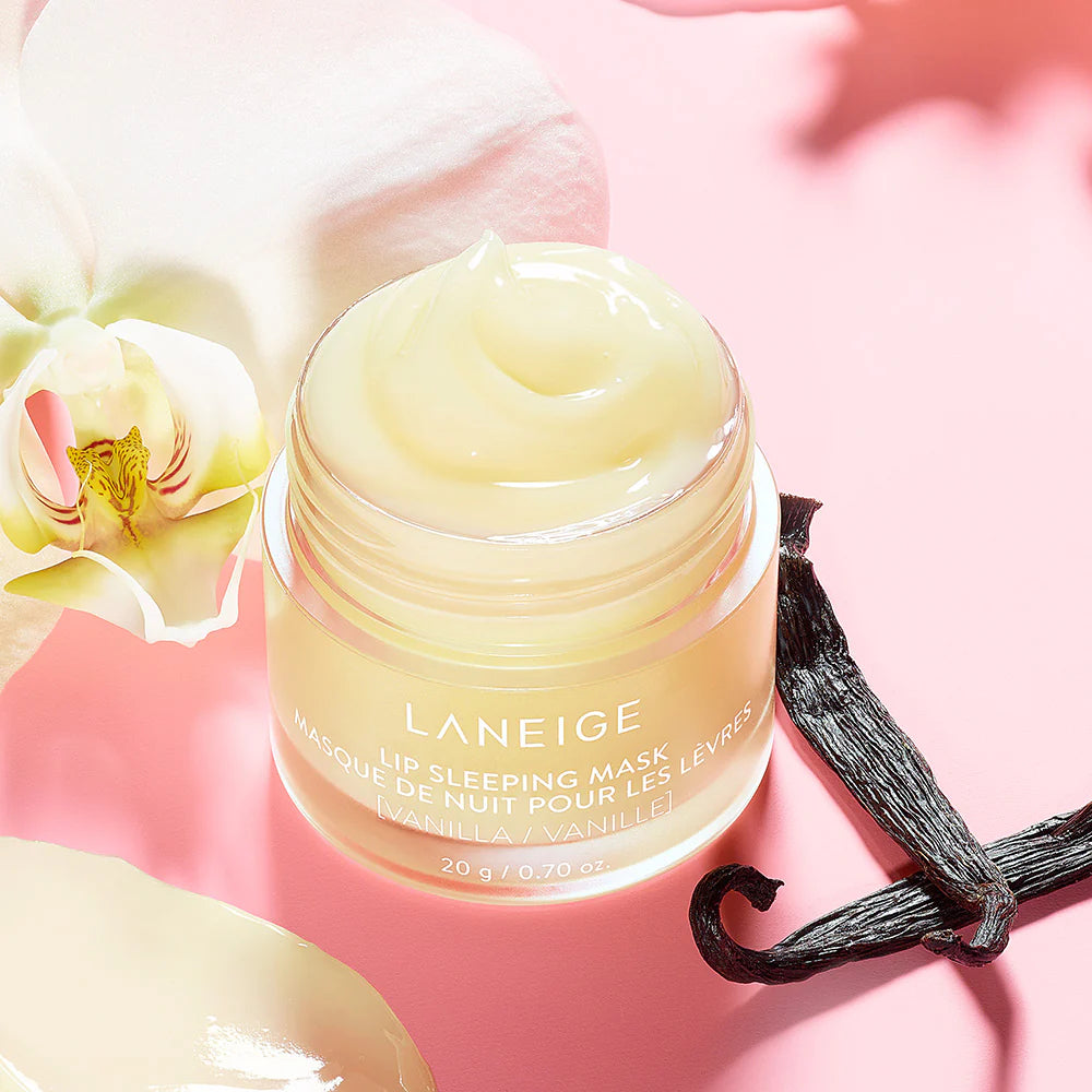 Laneige lip sleeping mask jar with vanilla bean and orchid on a pink background