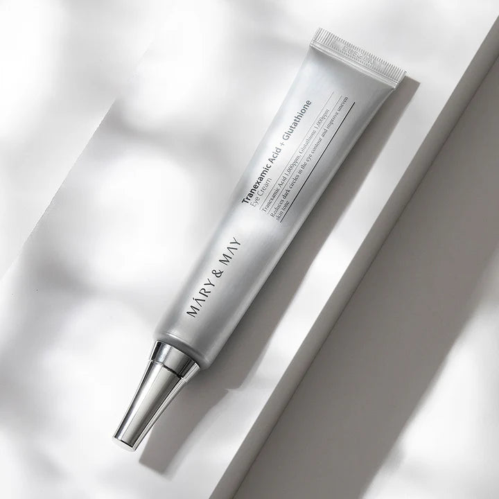 Skincare tube labeled 'MARY & MAY' on a light background