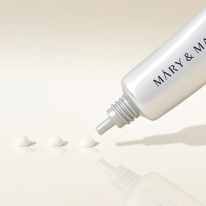 White bottle with 'MARY & MARY' branding on a beige background