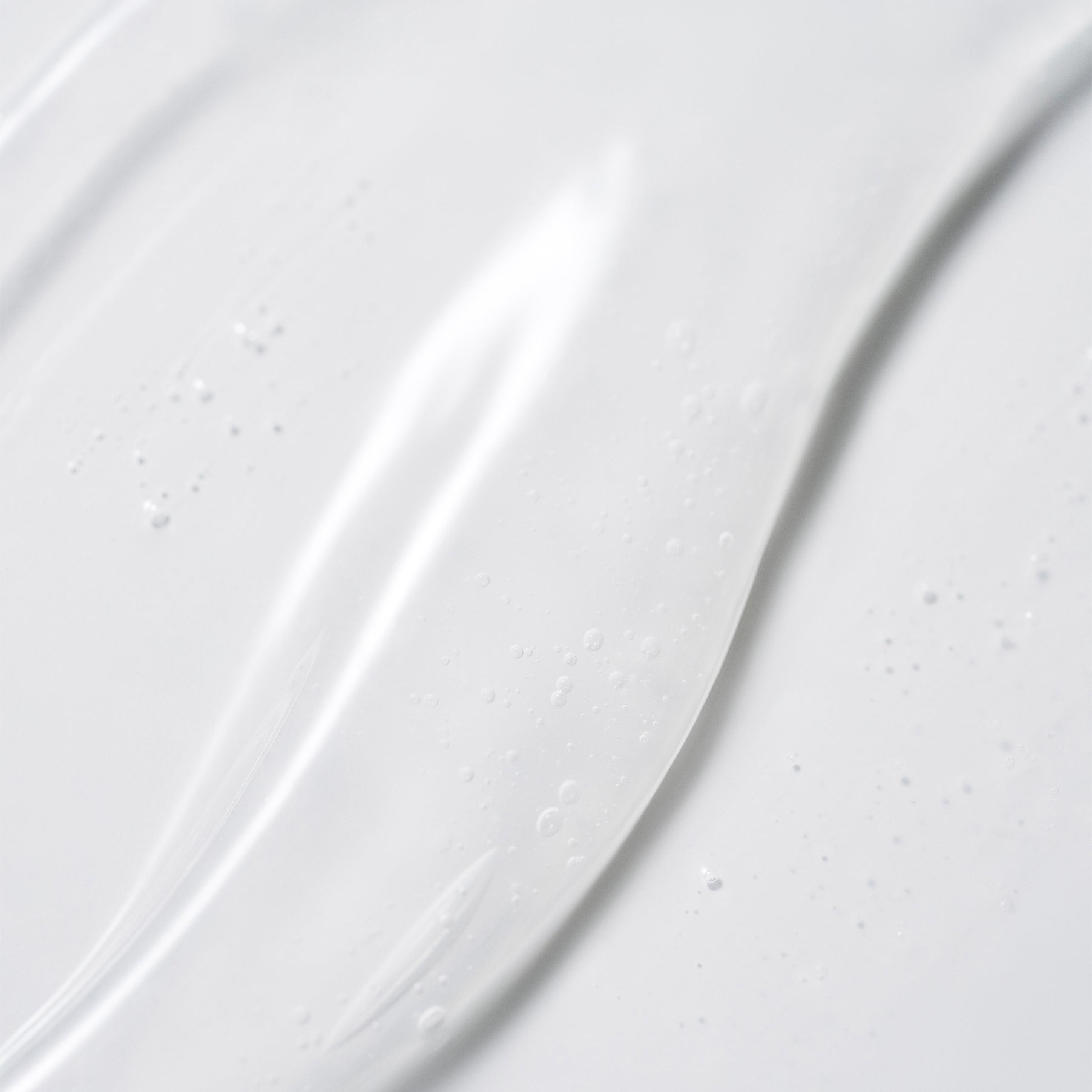 Close-up of a white ceramic plate with subtle texture