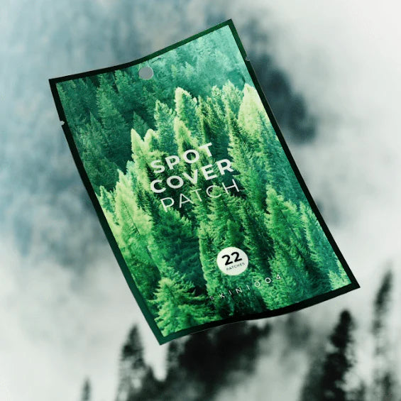 Packaging of a spot cover patch with a forest design on a blurred forest background