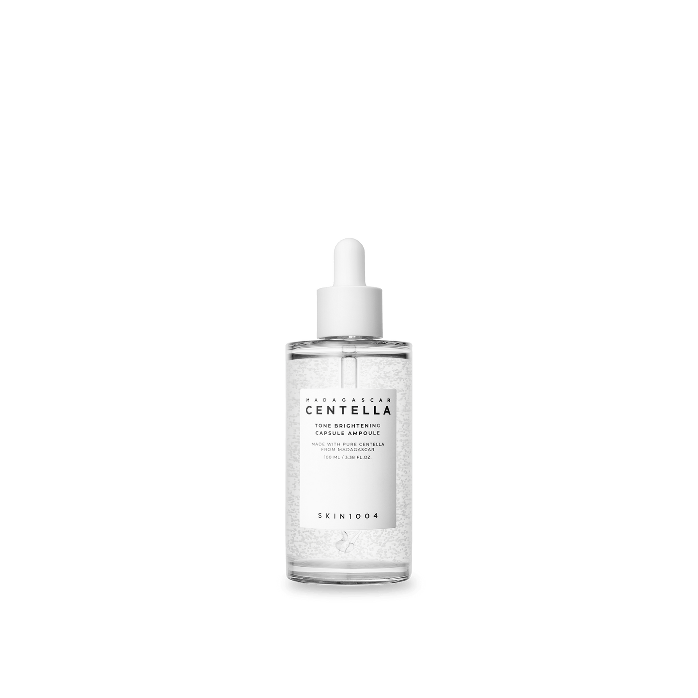 Skincare dropper bottle with Centella Asiatica on a green background