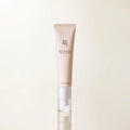 Skincare tube with brand name on a light beige background