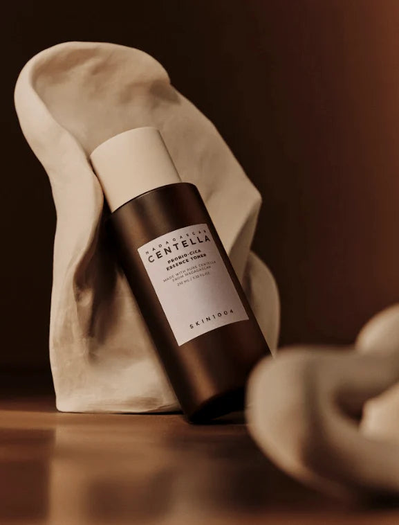 Skintone Centella bottle on a textured surface with a blurred background
